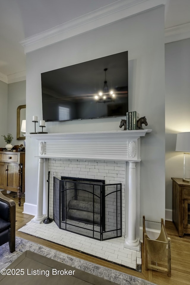 interior details featuring hardwood / wood-style flooring and ornamental molding