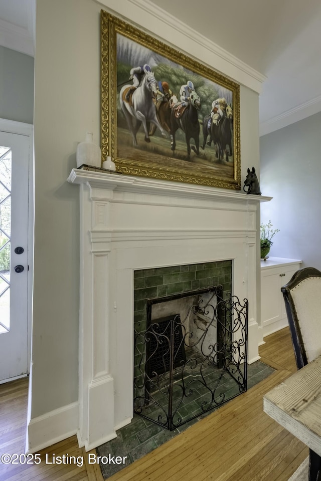 room details with wood-type flooring and ornamental molding