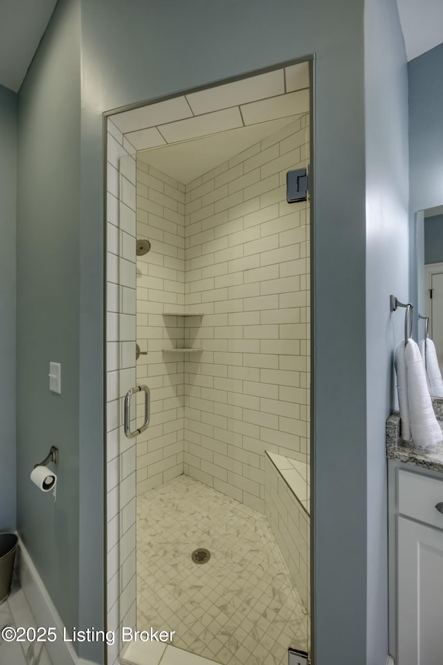 bathroom with a shower with shower door