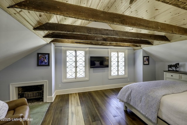 bedroom featuring dark wood-type flooring, lofted ceiling with beams, and wooden ceiling