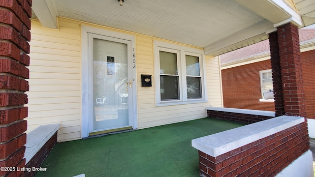 doorway to property with a porch