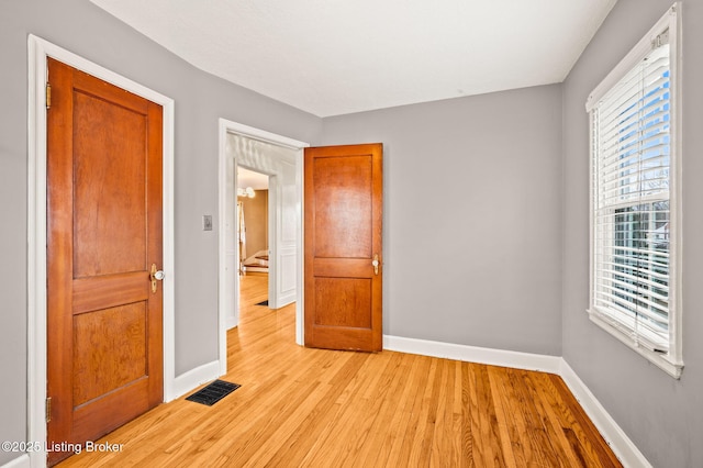 unfurnished bedroom with light hardwood / wood-style flooring