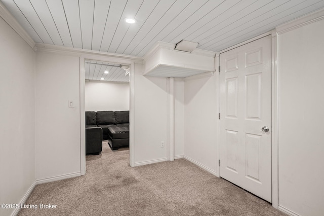 interior space with light carpet, crown molding, and wooden ceiling