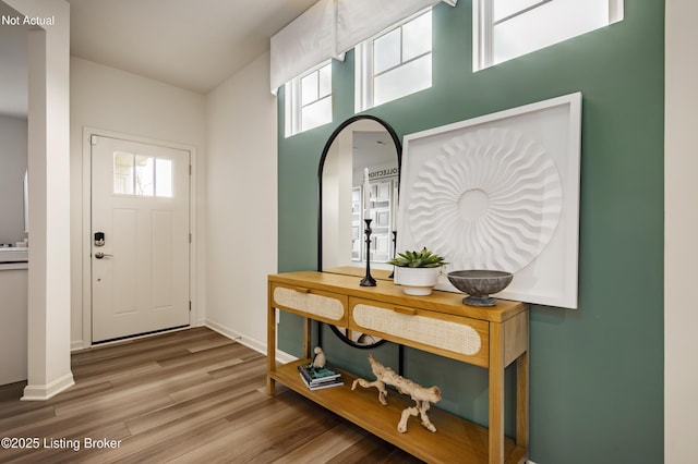 entryway with hardwood / wood-style flooring