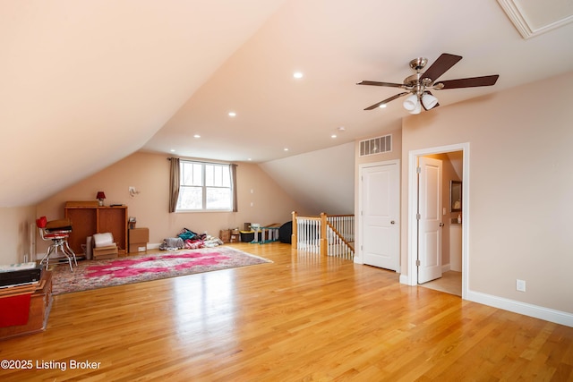 additional living space featuring vaulted ceiling, ceiling fan, and light wood-type flooring