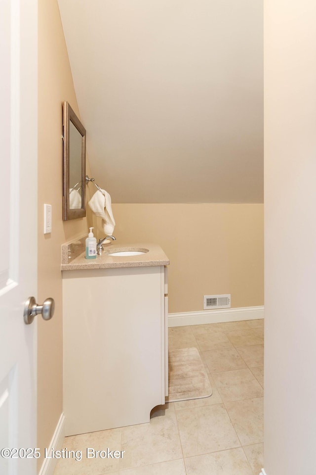 bathroom with sink and light tile patterned floors