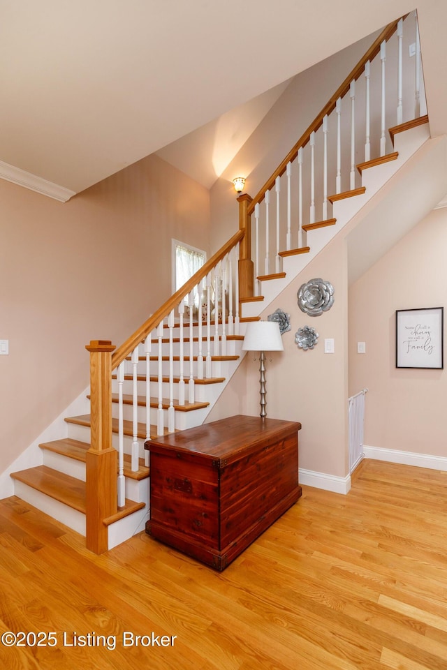 stairs with wood-type flooring