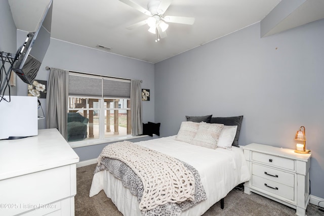 bedroom featuring dark colored carpet and ceiling fan