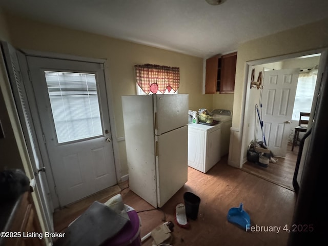 kitchen with white refrigerator and light wood-type flooring