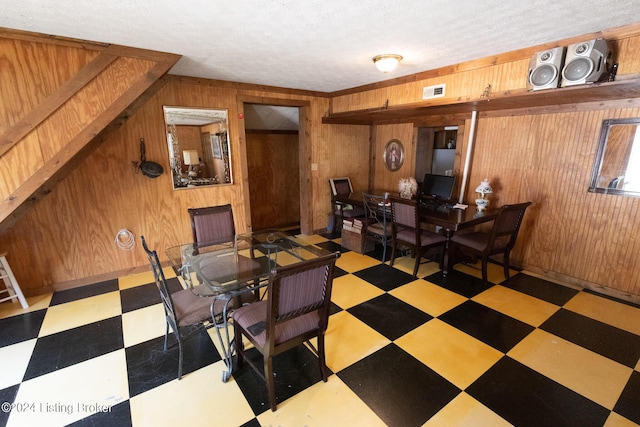 dining area with wooden walls