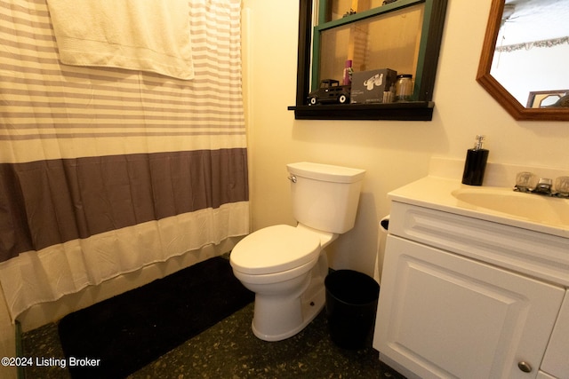 bathroom with vanity, toilet, and curtained shower