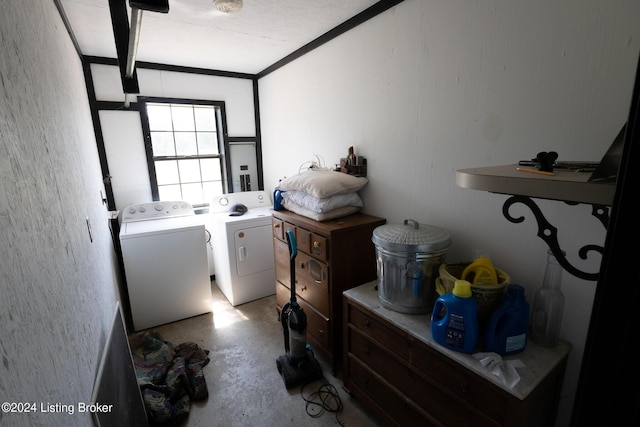 clothes washing area with washing machine and dryer