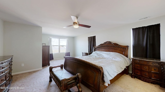 bedroom featuring ceiling fan and light colored carpet