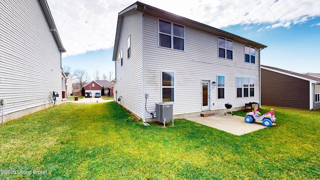 back of house with a patio, a yard, and cooling unit