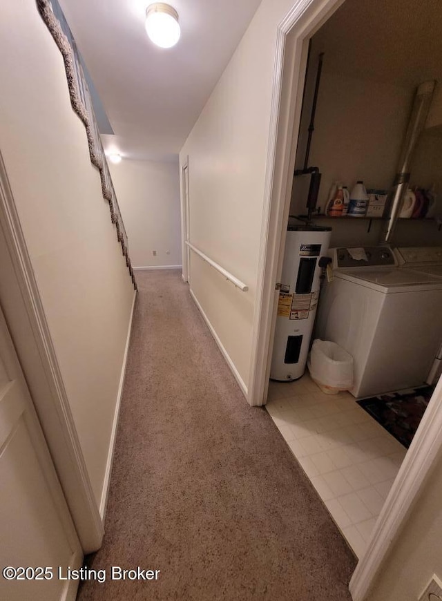 hallway featuring separate washer and dryer and water heater