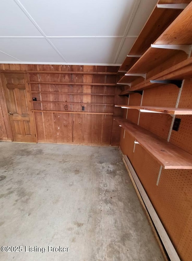 storage room featuring a baseboard heating unit