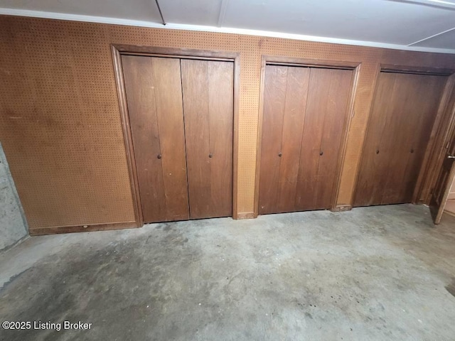 unfurnished bedroom featuring two closets