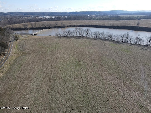 birds eye view of property featuring a water view and a rural view