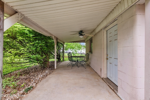 view of patio featuring a ceiling fan and outdoor dining area