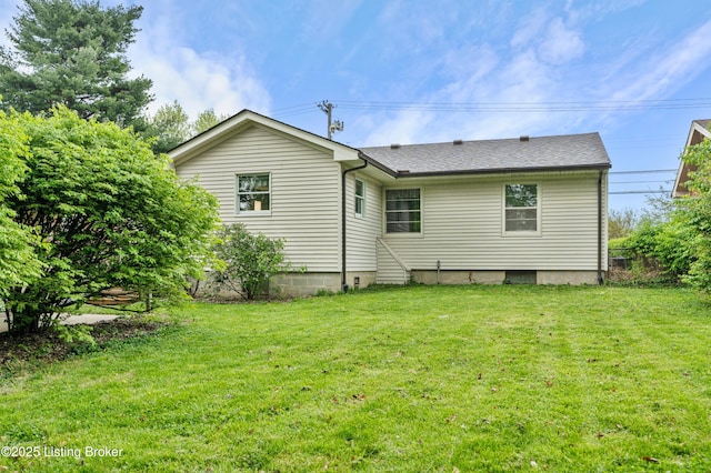 back of house featuring a yard