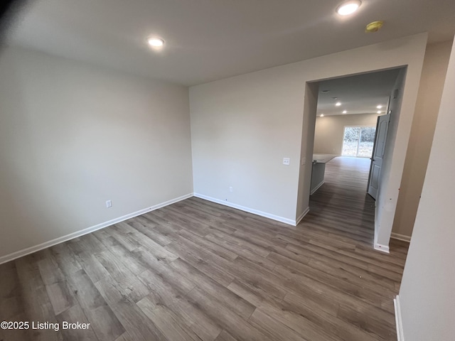 empty room with wood-type flooring