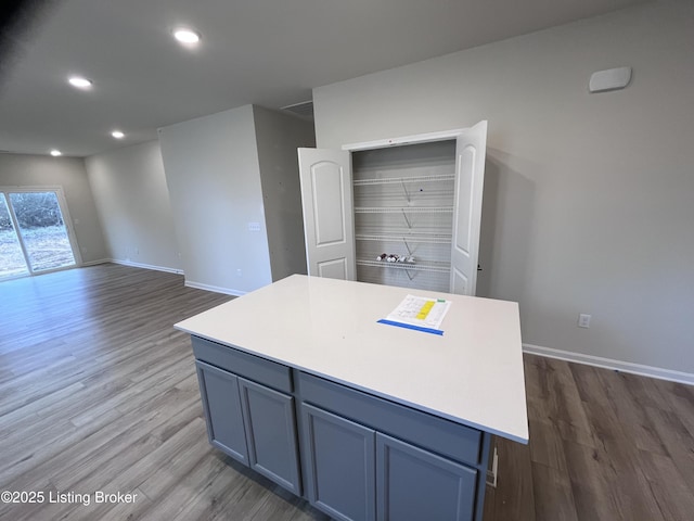 kitchen featuring dark hardwood / wood-style floors and a kitchen island