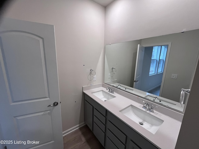 bathroom featuring vanity and hardwood / wood-style floors