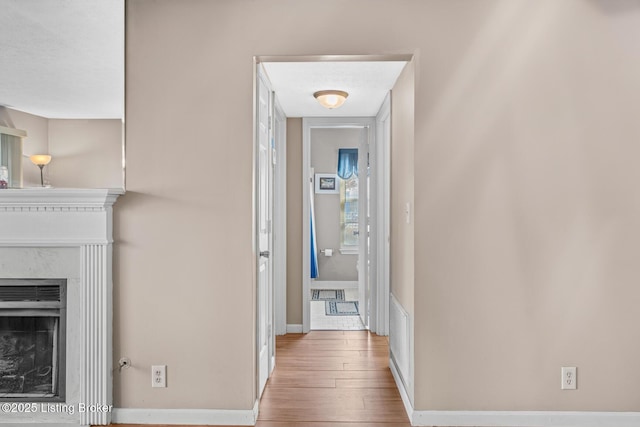 hallway featuring hardwood / wood-style flooring