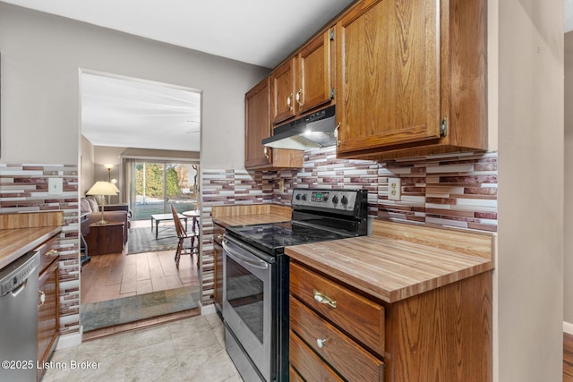 kitchen featuring dishwasher, light tile patterned floors, stainless steel range with electric cooktop, and decorative backsplash