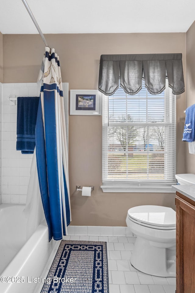 full bathroom featuring vanity, tile patterned floors, shower / bath combination with curtain, and toilet