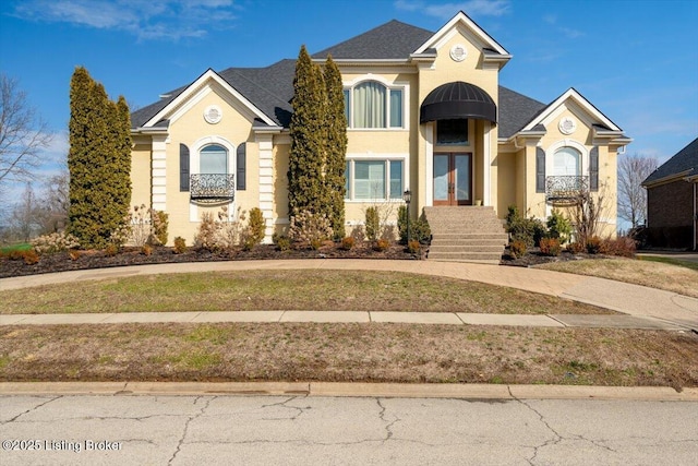 view of front of home featuring roof with shingles