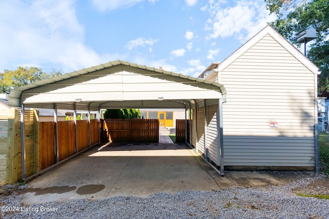 view of vehicle parking featuring a carport