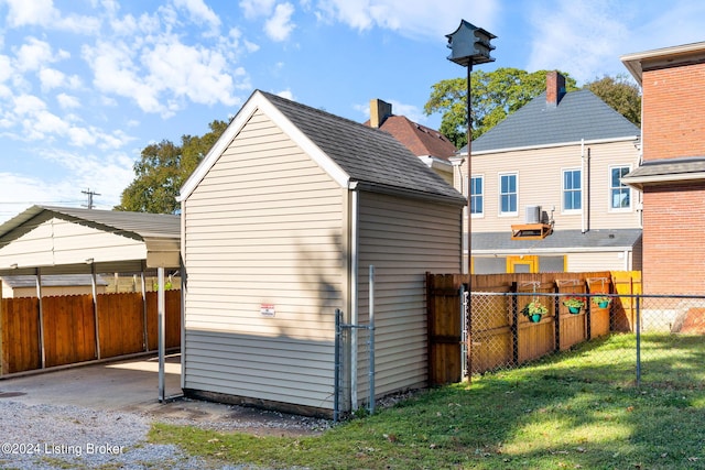 view of outbuilding with a yard