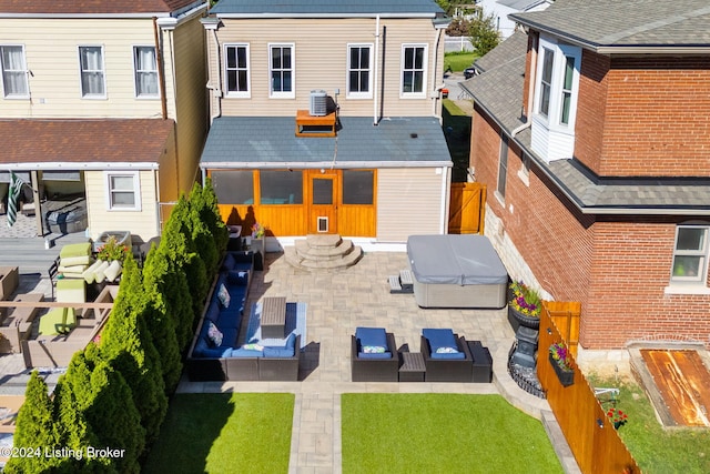 back of house with cooling unit, a patio area, and outdoor lounge area