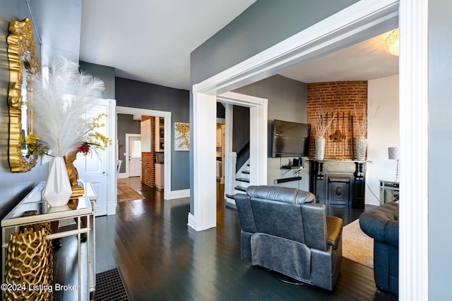 living room with dark hardwood / wood-style floors