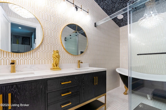 bathroom featuring vanity, a bath, and tile patterned flooring