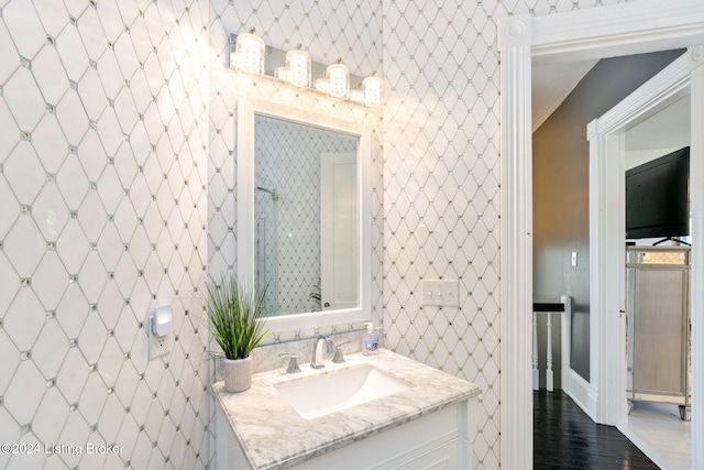 bathroom with vanity and hardwood / wood-style floors