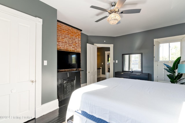 bedroom featuring dark hardwood / wood-style floors and ceiling fan