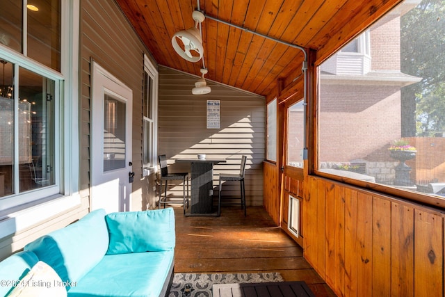 wooden deck featuring a bar