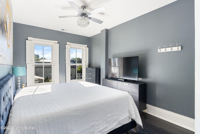 bedroom featuring dark hardwood / wood-style floors and ceiling fan