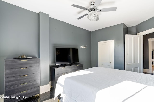 bedroom with wood-type flooring and ceiling fan