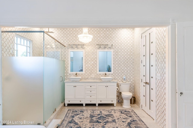 bathroom featuring tile walls, an enclosed shower, vanity, tile patterned floors, and toilet