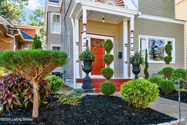 doorway to property featuring a porch