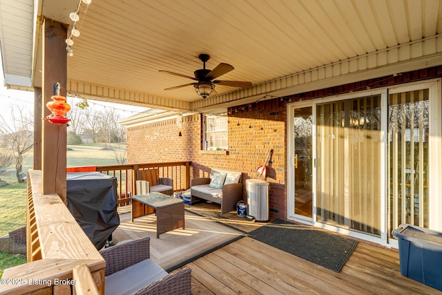 wooden deck featuring ceiling fan and an outdoor hangout area