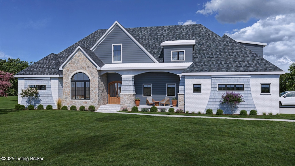 view of front facade with a front lawn and covered porch