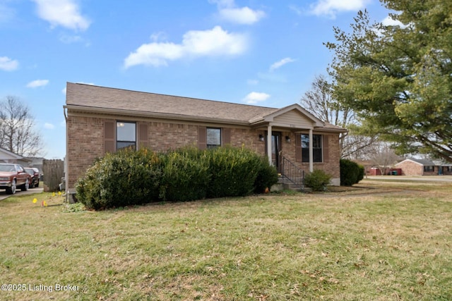 ranch-style home featuring a front yard