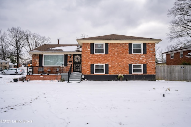 split level home with brick siding