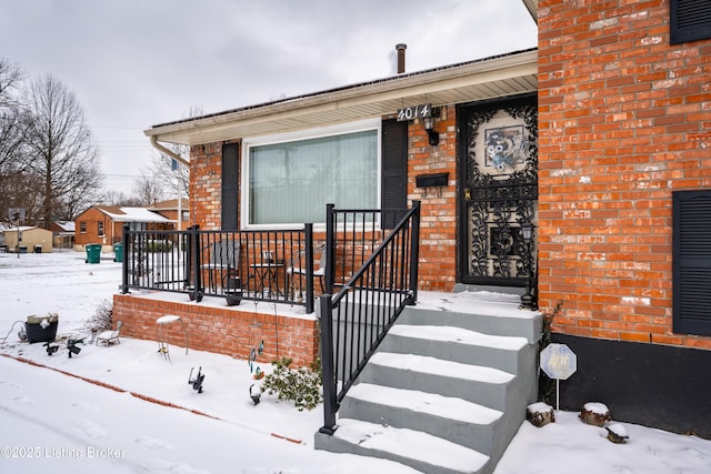 view of front of property featuring brick siding