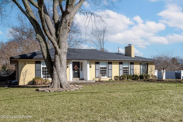 ranch-style house with a front lawn