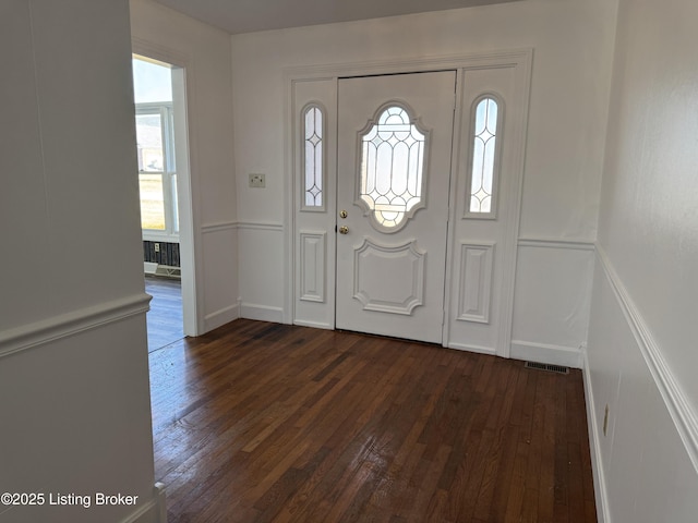 entrance foyer featuring dark hardwood / wood-style flooring